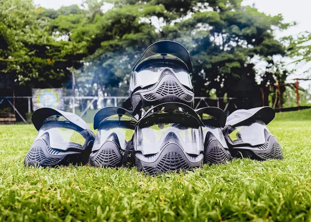 Close-up of a player wearing a protective paintball helmet during a game at Pertiwi Adventure Bali