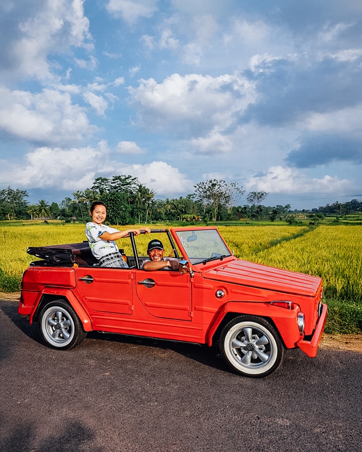 Classic Volkswagen tour passing through natural Bali scenery