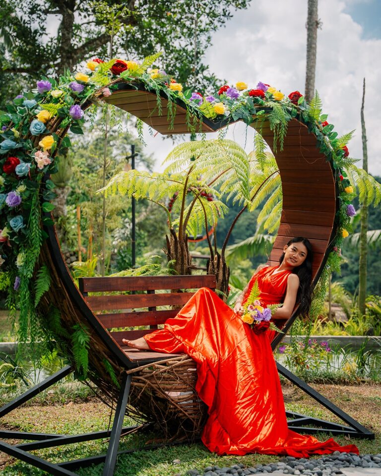 Woman enjoying the Love Seat experience at Pertiwi Jungle Swing in Bali